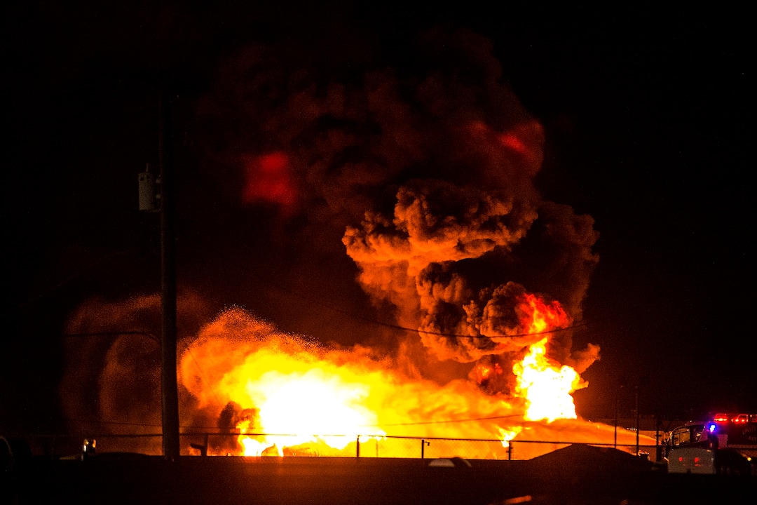 (Chris Detrick  |  The Salt Lake Tribune)  Firefighters attempt to put out a burning semitrailer that was hauling thousands of gallons of fuel on Interstate-15 in Midvale Thursday, January 18, 2018.   Lt. Todd Royce of the Utah Highway Patrol said the truck was southbound on the interstate at 7500 South at 7:20 p.m. when a tire caught fire, sending flames toward the tanks.