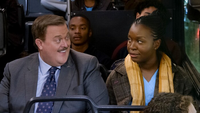 This image released by CBS shows Billy Gardell as Bob, left, and Folake Olowofoyeku as Abishola in a scene from "Bob (Hearts) Abishola," a comedy about a nurse and the former cardiac patient who pursues her.  (CBS via AP)