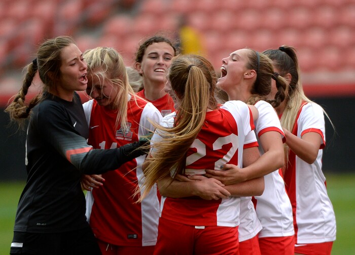 (Scott Sommerdorf   |  The Salt Lake Tribune)   American Fork's Jamie Shepherd, #22, celebrates with team mates after her goal put the Cavemen ahead at 2-1. American Fork beat Syracuse 3-1 to win the 6A championship game played at Rio Tinto, Friday, October 20, 2017. 