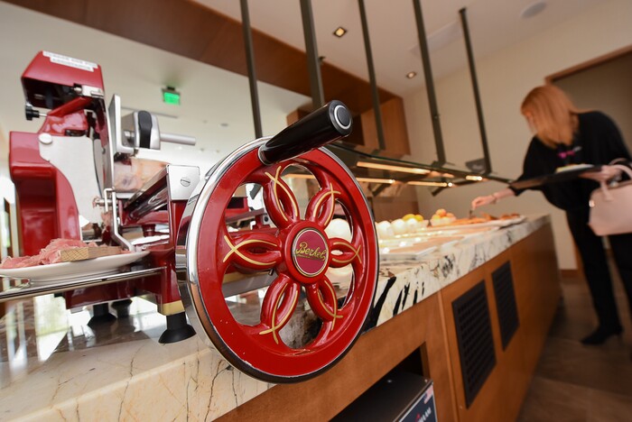 (Francisco Kjolseth  |  The Salt Lake Tribune)  The new AC Hotel in Salt Lake City has a $10,000 Berkel prosciutto slicer. Fire Engine red with chrome trim and a fly wheel that turns manually, it cuts the prosciutto paper thin for the hotel's daily continental breakfast.