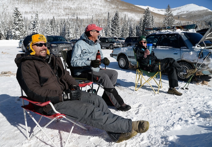 (Francisco Kjolseth  |  The Salt Lake Tribune)  Solitude Mountain Resort regulars John Fobair, Cary Dunn and Chet Schneider, from left, soak up the sunshine following a day of turns as they enjoy a blue bird day following a series of storms that have piled on the inches of snow in the high country on Thursday, Feb. 7, 2019.