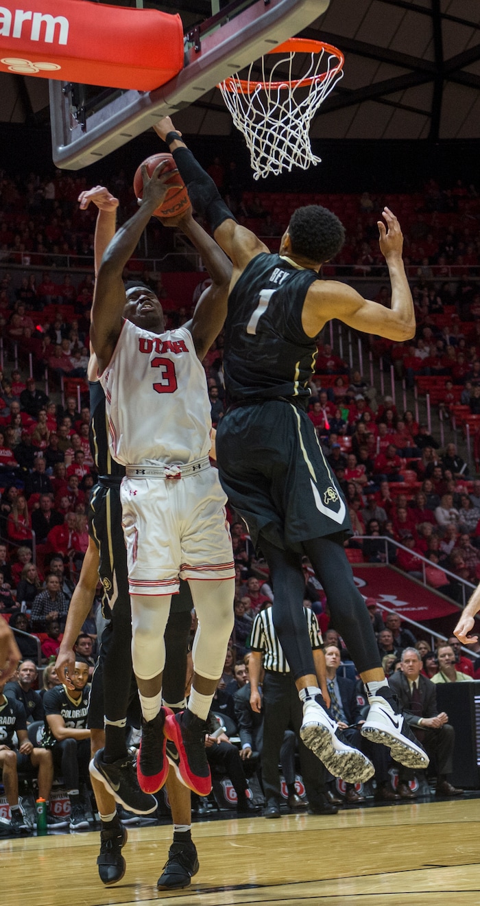 (Rick Egan  |  The Salt Lake Tribune)  Utah Utes forward Donnie Tillman (3) takes a shot, as Colorado Buffaloes guard Tyler Bey (1) defends, in PAC-12 basketball action between Utah Utes and Colorado Buffaloes, at the Jon M. Huntsman Center, Saturday, March 3, 2018.
