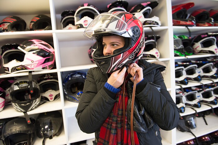 (Scott Sommerdorf   |  The Salt Lake Tribune)   
Samantha Varvell tries on a helmet prior to going out with her family to cut a Christmas tree. The Varvell family, visiting from Connecticut rented snowmobiles at Daniel Summit Saturday, December 23, 2017. While the number of snowmobile licenses in Utah is declining, trail usage is up dramatically.  