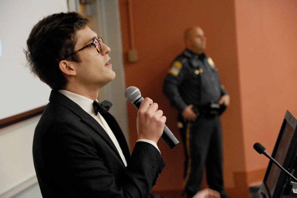 (Rebecca Lurye | The Courant | The Associated Press) In this Nov. 28, 2017 photo, Lucian Wintrich, White House correspondent for the right-wing blog Gateway Pundit, speaks at the University of Connecticut in Storrs, Conn. The conservative commentator was arrested and charged with breach of peace after an altercation during his speech titled "It's OK To Be White."