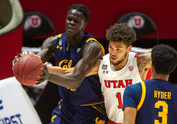 (Rick Egan | The Salt Lake Tribune) Utah Utes forward Timmy Allen (1) tries to take the ball away from California Golden Bears forward Kuany Kuany (13), in PAC12 Basketball action between the the Utah Utes and the California Golden Bears, on Wednesday, Jan. 16, 2021.