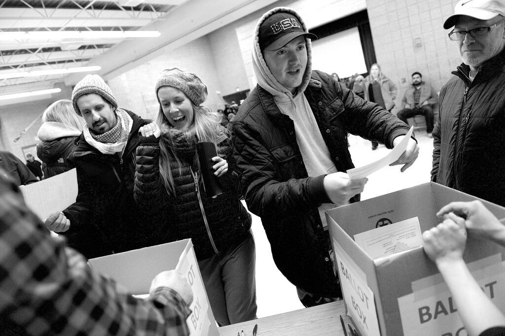 Leah Hogsten  |  The Salt Lake TribuneElliot McDaniel (right) and his father Darin waited in line for two hours before they cast their ballot. Lines and wait times were long at the Democratic caucus at Mountain View Elementary School as both registered party members and unaffiliated voters cast their ballots, Tuesday, March 22, 2016.