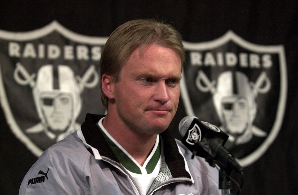 FILE - In this Jan. 14, 2001, file photo, then-Oakland Raiders' coach Jon Gruden is shown during a press conference at Raiders headquarters in Alameda, Calif. Jon Gruden says he had a good talk with Oakland Raiders owner Mark Davis about returning to the organization for a second stint as coach and believes there is a "good chance" it will happen.  Gruden gave an interview to ESPN Radio on Wednesday, Jan. 3, 2018, to discuss his pursuit of the Raiders job that opened when Jack Del Rio was fired after a disappointing six-win season. (AP Photo/Ben Margot, File)