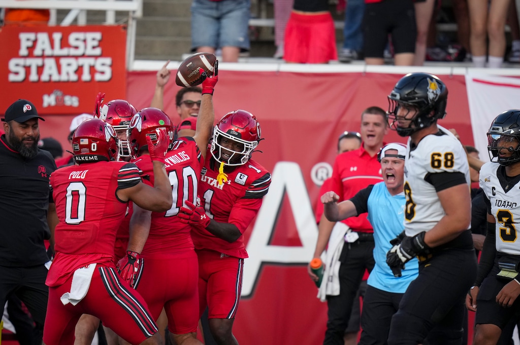 (Bethany Baker  |  The Salt Lake Tribune) Utah Utes celebrate an interception during the first half of the game between the Utah Utes and the Idaho Vandals at Rice-Eccles Stadium in Salt Lake City on Thursday, Sept. 3, 2026.