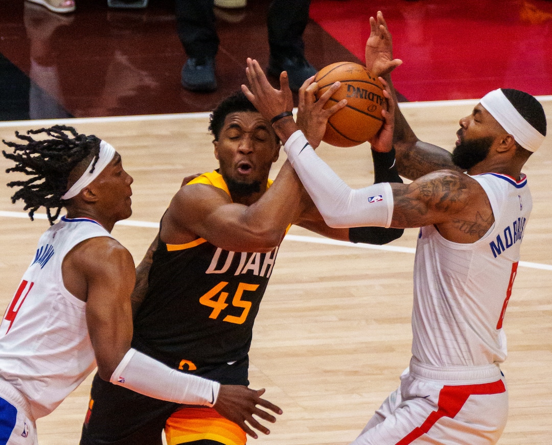 (Trent Nelson  |  The Salt Lake Tribune) LA Clippers guard Terance Mann (14), Utah Jazz guard Donovan Mitchell (45), and LA Clippers forward Marcus Morris Sr. (8) as the Utah Jazz host the Los Angeles Clippers in a Game 5 matchup, NBA basketball in Salt Lake City on Wednesday, June 16, 2021.