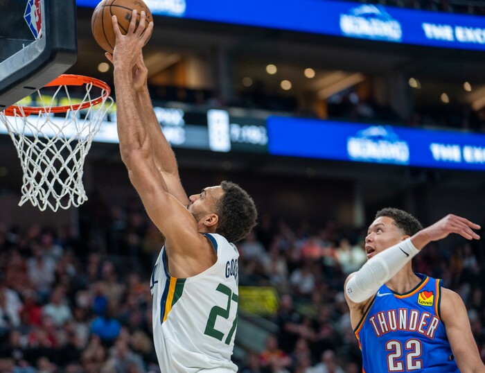 (Rick Egan | The Salt Lake Tribune) Utah Jazz center Rudy Gobert (27) scores as Oklahoma City Thunder forward Isaiah Roby (22) defends, in NBA action between the Utah Jazz and the Oklahoma City Thunder at Vivint Arena, on Wednesday, April 6, 2022.
