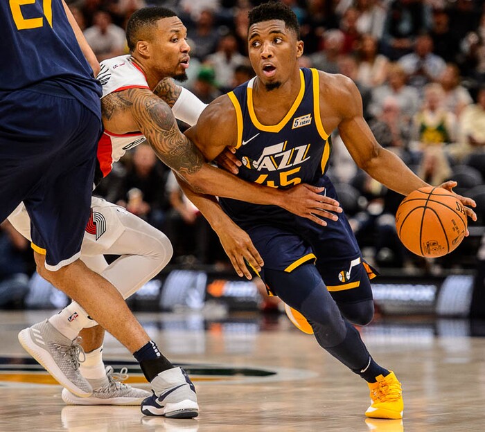 (Trent Nelson | The Salt Lake Tribune)  Utah Jazz guard Donovan Mitchell (45) drives while Utah Jazz center Rudy Gobert (27) sets a pick on Portland Trail Blazers guard Damian Lillard (0) as the Utah Jazz host the Portland Trail Blazers, NBA basketball in Salt Lake City, Wednesday November 1, 2017.