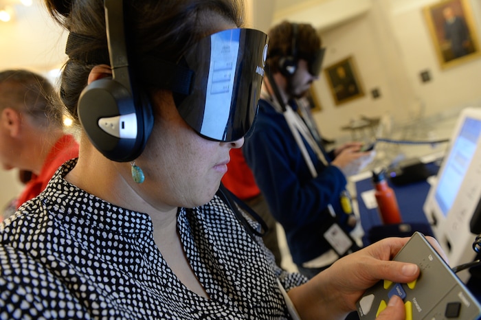 (Francisco Kjolseth  |  The Salt Lake Tribune)  Chanar Goodrich of Ogden takes advantage of an invitation to try five new voting machines by different manufacturers including Election Systems & Software that can accommodate the visually impaired. Companies demonstrated new voting machines that the state is considering buying during a hands on presentation at the Capitol on Wednesday, Aug. 2, 2017.