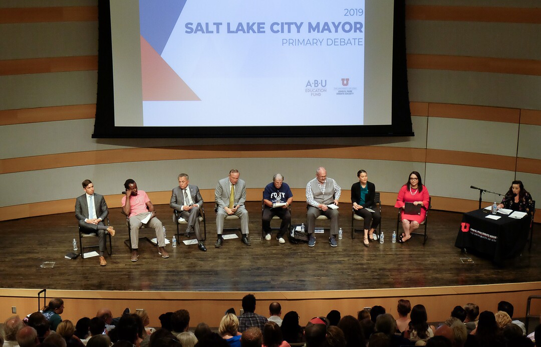 (Francisco Kjolseth  |  The Salt Lake Tribune)  All eight of the candidates for Salt Lake City mayor gather for a debate at the Salt Lake City Library on Wed. June 26, 2019, which includes, from left, David Garbett, Abi Olufeko standing in for Rainer Huck, David Ibarra, Jim Dabakis, Richard Goldberger, Stan Penfold, Erin Mendenhall and Luz Escamilla. The debate was hosted by the ABU Education Fund and the University of Utah’s John R. Park Debate Society and moderated by Averie Vockel.