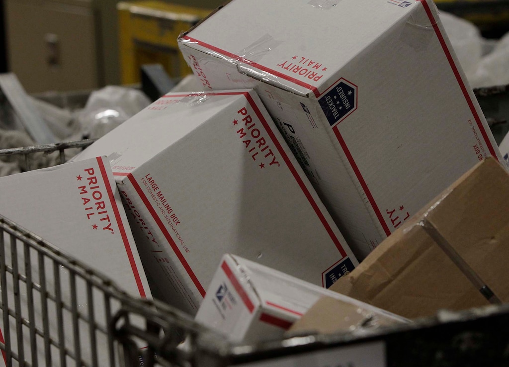 (Leah Hogsten  |  The Salt Lake Tribune) Packages wait to be processed at the United States Postal Service's Salt Lake City main processing center on Dec. 10, 2013.