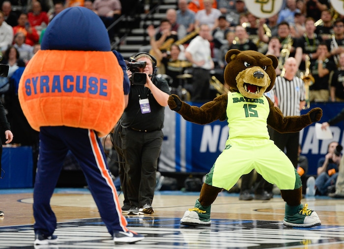 (Francisco Kjolseth  |  The Salt Lake Tribune)  The Syracuse and Baylor mascots face off in a dance battle in the first round menÕs NCAA March Madness tournament game at Vivint Smart Home Arena in Salt Lake City on Thursday, March 21, 2019.