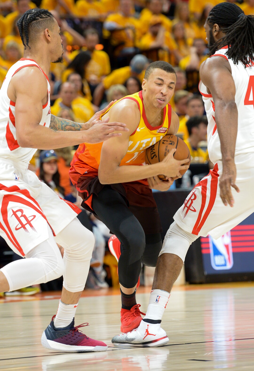 (Leah Hogsten  |  The Salt Lake Tribune) Utah Jazz guard Dante Exum (11) fights to get past Houston Rockets guard Gerald Green (14) and Houston Rockets center Nene Hilario (42) as the Utah Jazz take on the Houston Rockets in Game 3 of an NBA basketball second-round playoff series Friday, May 4, 2018 in Salt Lake City.