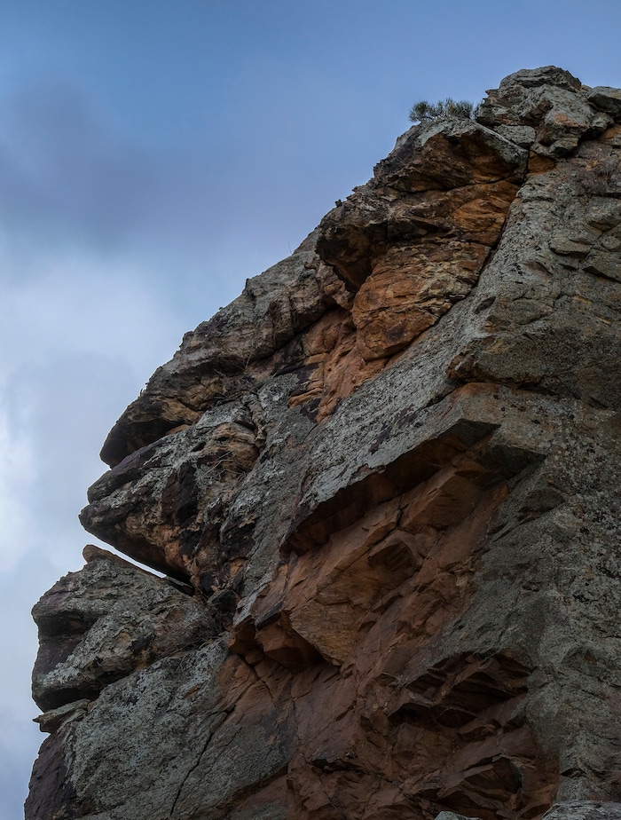 (Leah Hogsten | The Salt Lake Tribune) The face seen in the southeastern rock wall of the Parowan Gap, according to Nancy Dalton, a guide with the Parawon Heritage Foundation, resembles a human face, complete with a slit that looks like a mouth. "We call him the Overseer," said Dalton. "In November, the sun rolls into his mouth and he swallows it and then he spits the sun out of his mouth in February."
