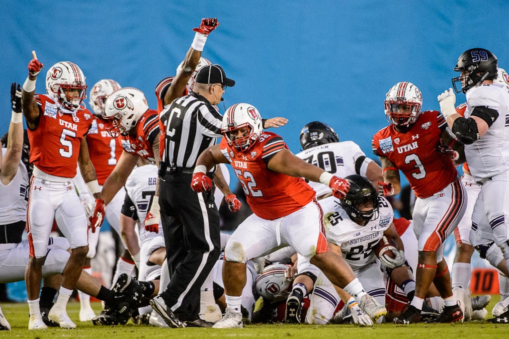 (Trent Nelson | Tribune file photo) Utah Utes defensive tackle John Penisini (52), shown celebrating a fourth-down stop vs. Northwestern in the 2018 Holiday Bowl, has earned a degree from the school and is using his senior year of eligibility to pursue another undergraduate degree.