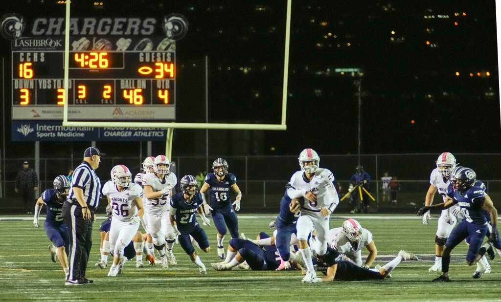 (Leah Hogsten | The Salt Lake Tribune) Lone Peak's quarterback Easton Comer runs the ball on a quarterback keeper. The Knights ended Corner Canyon's 48-game winning streak with a 41-16 win over the Chargers on Thursday.