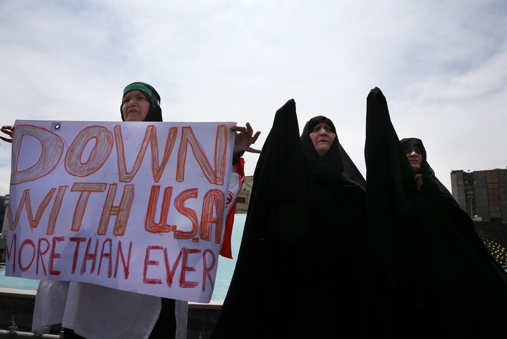 (Vahid Salemi | The Associated Press) Iranian women attend an anti-U.S. gathering after the Friday prayer in Tehran, Iran, Friday, May 11, 2018. Thousands of Iranians took to the streets in cities across the country to protest U.S. President Donald Trump's decision to pull out of the nuclear deal with world powers.