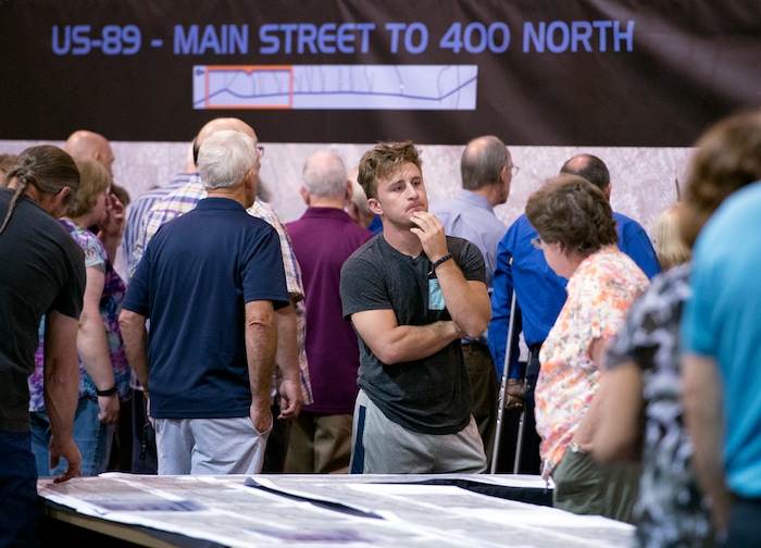 (Leah Hogsten | The Salt Lake Tribune) Davis Marriott, center, found out that UDOT would take his mother's home in Layton for the proposed freeway.
Utah Department of Transportation (UDOT) representatives fielded hundreds of questions from concerned Davis County residents seeking information about the US-89 State Environmental Study and the proposal to convert US-89 in Davis County into a freeway. The formal public comment period continues through Monday September 25.