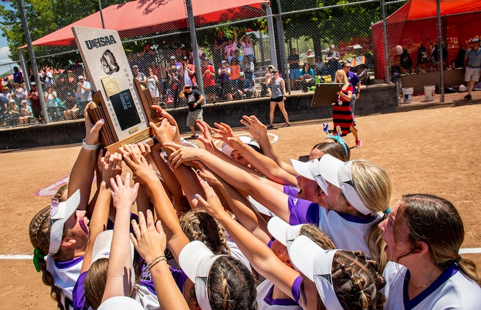 (Isaac Hale | Special to The Tribune) Riverton players celebrate around the championship trophy after defeating the Bingham Miners in a best-of-three series to win the 6A state softball championship at the Spanish Fork Sports Park on Friday, May 28, 2021.