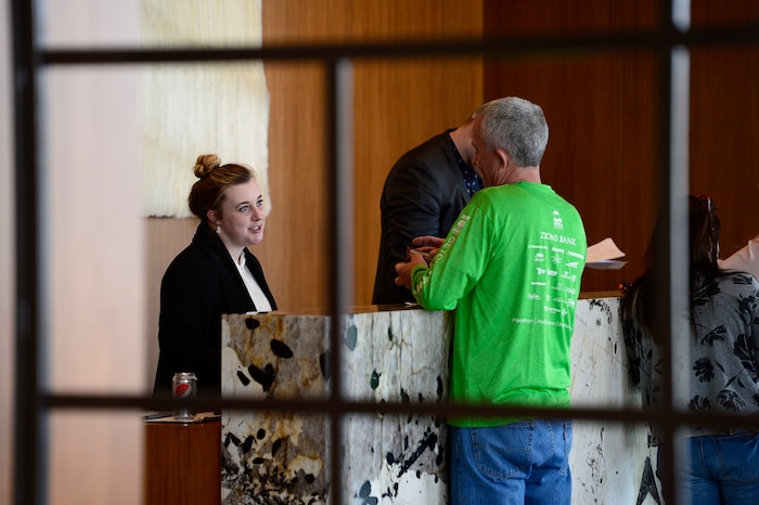 (Scott Sommerdorf | The Salt Lake Tribune)
Camille Hollingsworth helps a guest at the reception desk at the new AC Hotel in downtown Salt Lake City, Friday, April 20, 2018. Hotels and other lodging properties had 11 percent more employees last month than in the previous March, helping to lead Utah to a 3.3 percent year-over-year job growth rate, the best in the nation.