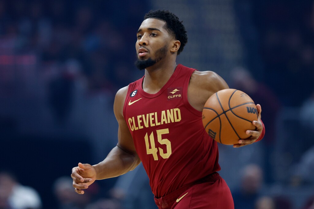 Cleveland Cavaliers guard Donovan Mitchell plays against the Indiana Pacers during the first half of an NBA basketball game, Friday, Dec. 16, 2022, in Cleveland. The Utah Jazz will face Mitchell — their former teammate — on Monday. (AP Photo/Ron Schwane)