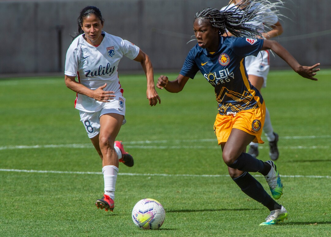 (Rick Egan  |  The Salt Lake Tribune)  Utah Royals FC midfielder Aminata Diallotakes the ball downfield as midfielder Shirley Cruz defends for Ol Reign FC, in soccer action between Utah Royals FC and Ol Reign FC at Rio Tinto Stadium in Sandy, Saturday, Sept. 26, 2020.