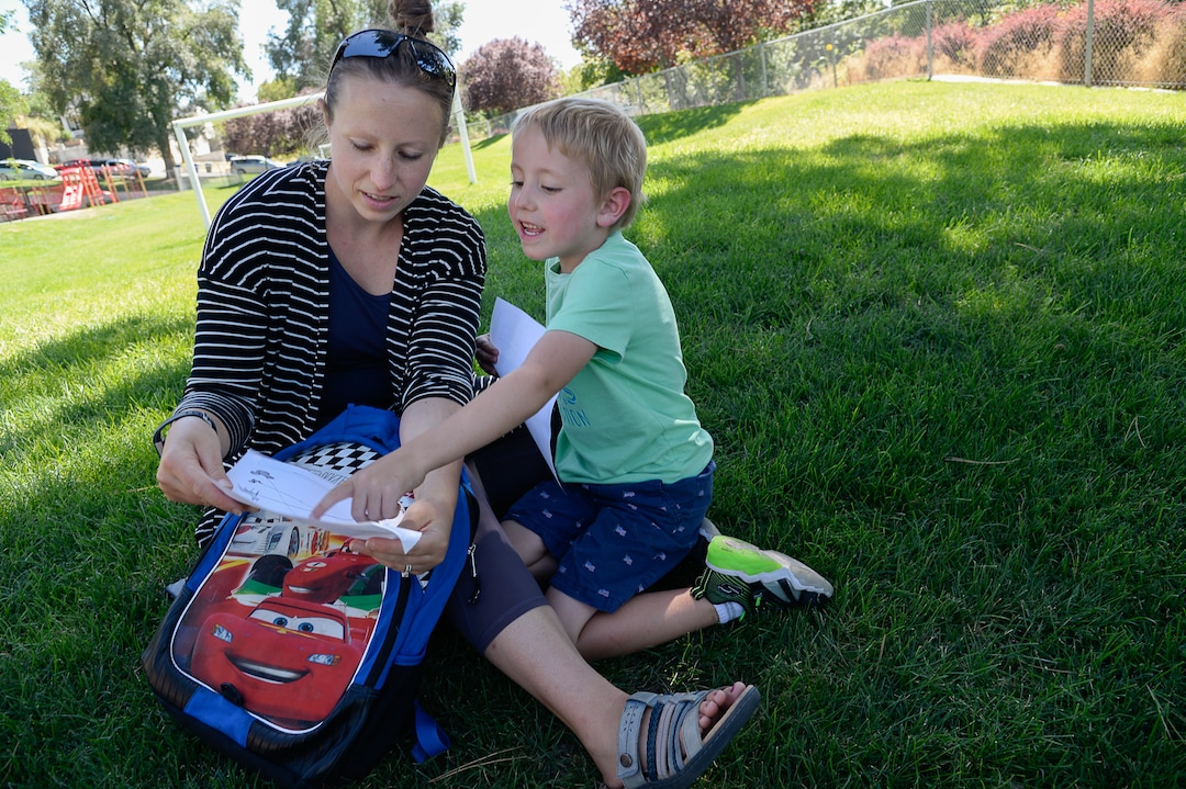 (Francisco Kjolseth  |  The Salt Lake Tribune)  Lana Medina learns about some of the fun assignments her son Dylan, 5, had a chance to do on his first day of kindergarten at Washington Elementary on Monday, Aug. 19, 2019.
