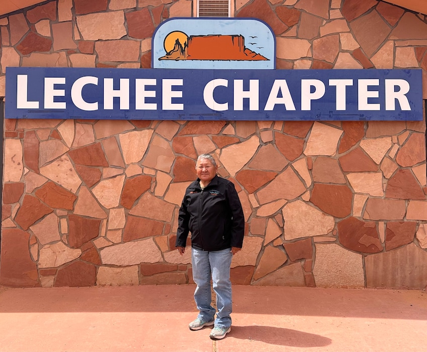 (Beth Henshaw | Corner Post) Irene Whitekiller, LeChee Chapter President, standing in front of the LeChee Chapter House. The LeChee Chapter of the Navajo Nation voted unanimously in February to pass a resolution opposing the City of Page’s decision last year to sell 500 acres of recreational land for a $10 billion data center development. The proposed development site borders the LeChee Chapter, a home to the internationally popular tourist destination of Antelope Canyon.
