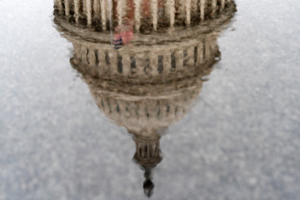 (Jacquelyn Martin | AP photo)

The U.S. Capitol has a painterly effect as it is seen reflected through a puddle as raindrops fall during a rainstorm, Thursday, Dec. 24, 2020, in Washington.