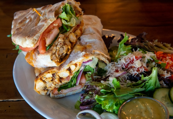 (Rick Egan  |  The Salt Lake Tribune)     Buffalo Chicken Sandwich with House Salad, at Slackwater Pizzeria in Sandy, Thursday, March 5, 2020.