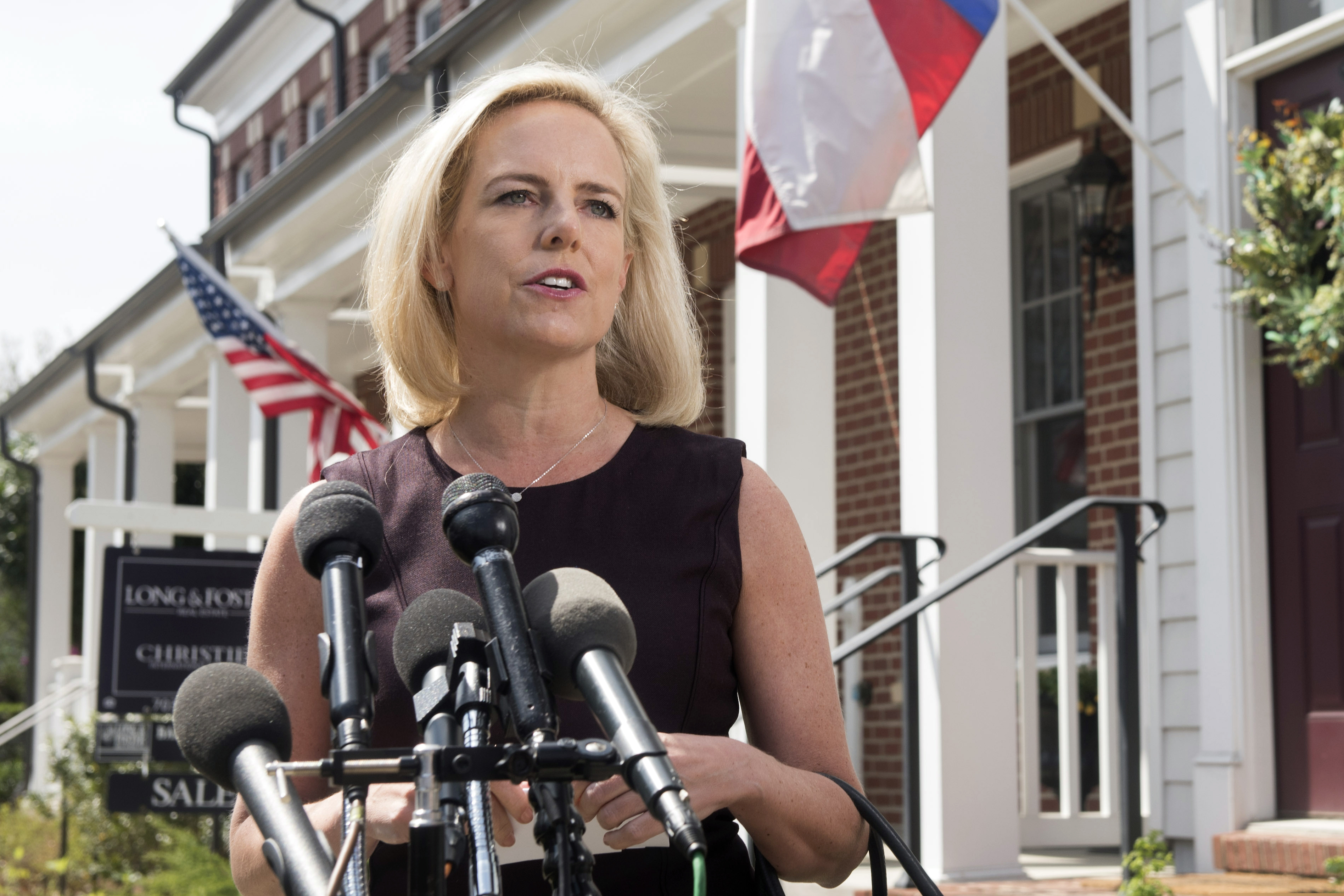 Homeland Security Secretary Kirstjen Nielsen talks outside her home in Alexandria, Va., on Monday, April 8, 2019. Nielsen says she continues to support the president’s goal of securing the border in her first public remarks since her surprise resignation. (AP Photo/Kevin Wolf)