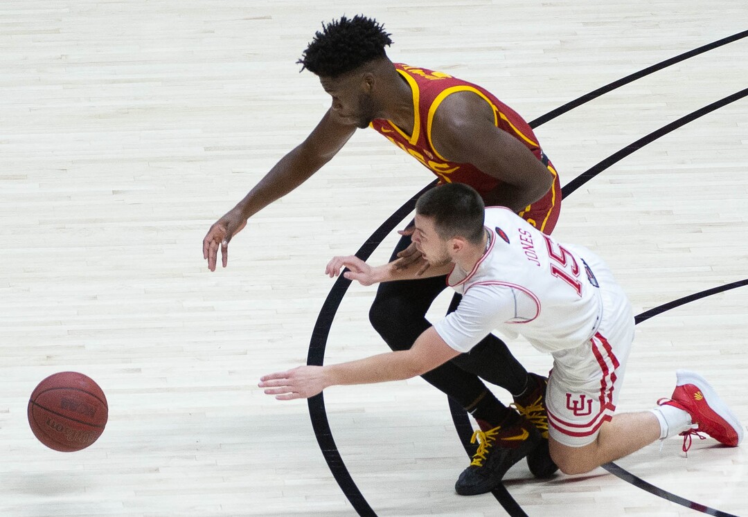 (Francisco Kjolseth  | The Salt Lake Tribune) USC Trojans forward Chevez Goodwin (1) collides with Utah Utes guard Rylan Jones (15) in PAC-12 basketball action at the Jon M. Huntsman Center, on Saturday, Feb. 27, 2021.