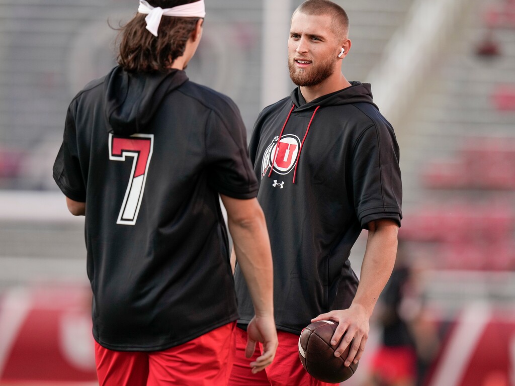 (Leah Hogsten | The Salt Lake Tribune)  Utah Utes quarterback Cameron Rising (7) talks with Utah Utes tight end Brant Kuithe (80) during warm up as the University of Utah prepare to take on San Diego State at Rice-Eccles Stadium in Salt Lake City,  Sept. 17, 2022. Kuithe was one of six Utes named to the Pac-12's preseason all-conference team Tuesday.
