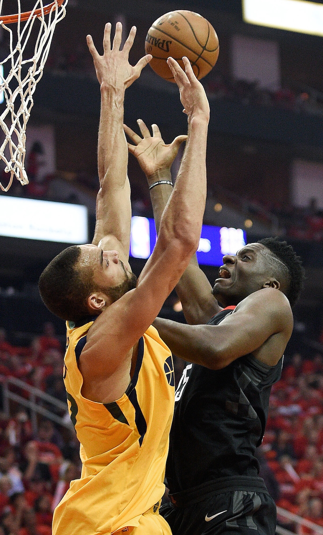 Houston Rockets center Clint Capela, right, shoots as Utah Jazz center Rudy Gobert defends during the first half in Game 1 of an NBA basketball second-round playoff series, Sunday, April 29, 2018, in Houston. (AP Photo/Eric Christian Smith)