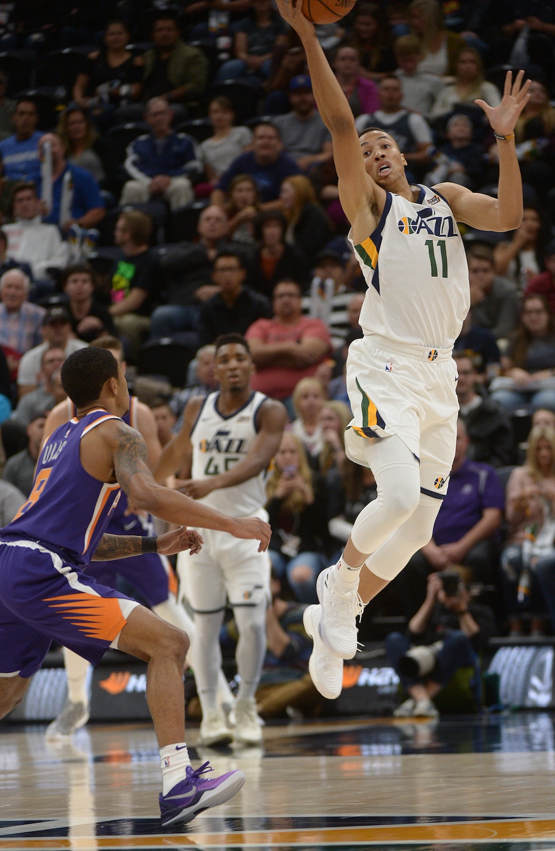 (Leah Hogsten  |  The Salt Lake Tribune)  Utah Jazz guard Dante Exum (11) flies high to catch a pass. The Utah Jazz defeated the Phoenix Suns 112-101 during preseason NBA basketball at Vivint Smart Home Arena in Salt Lake City, October 6, 2017.