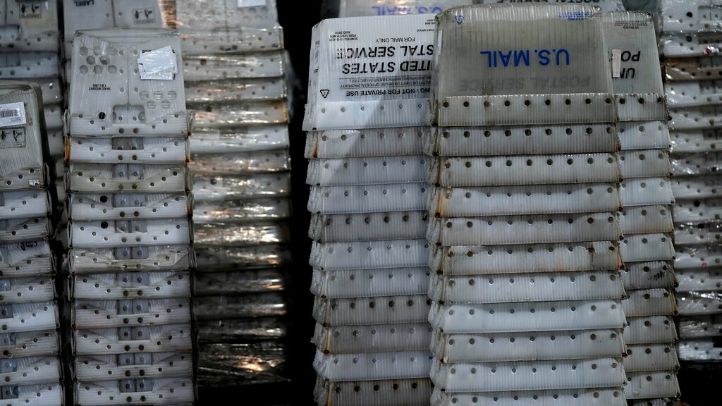 (Gerry Broome | AP) Empty postal boxes await packages at the Wake County Board of Elections as workers prepare absentee ballots for mailing in preparation for the upcoming election in Raleigh, N.C., Thursday, Sept. 3, 2020.