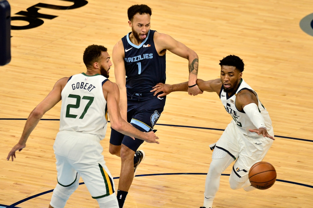 (Brandon Dill | AP) Memphis Grizzlies forward Kyle Anderson (1) and Utah Jazz guard Donovan Mitchell (45) struggle for control of the ball ahead of Jazz center Rudy Gobert (27) in the first half of Game 4 of an NBA basketball first-round playoff series Monday, May 31, 2021, in Memphis, Tenn.