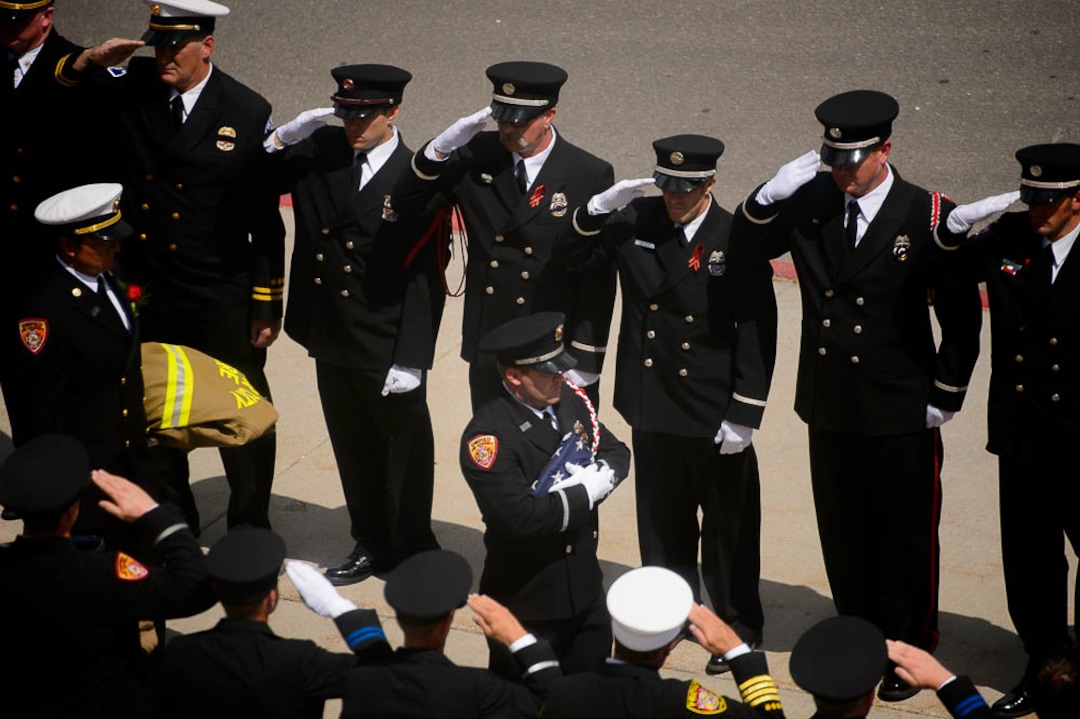 (Trent Nelson | The Salt Lake Tribune)  Funeral services for Battalion Chief Matthew Burchett at the Maverik Center in West Valley City, Monday Aug. 20, 2018.