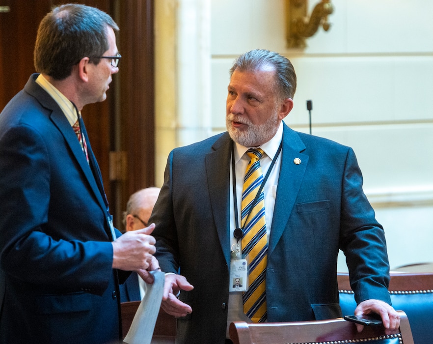 (Rick Egan  |  The Salt Lake Tribune)  Sen. Curtis Bramble, R-Provo, right, chats on the Senate floor with  Rep. Ray Ward, R-Bountiful, Thursday, Feb. 20, 2020. Bramble is the sponsor of a controversial bill that would require fetal remains from an abortion or miscarriage to be buried or cremated.