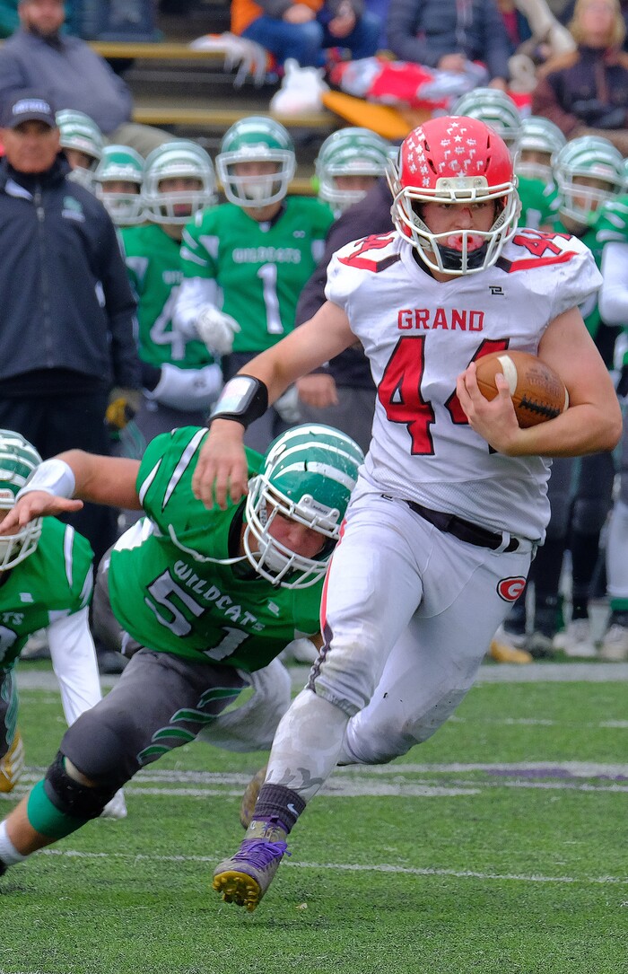 (Leah Hogsten  |  The Salt Lake Tribune) Grand County's Joseph Downard runs for a first down. South Summit High School boys' football team leads Grand County High School 34-3 during their class 2A state semifinal football game Saturday, November 4, 2017 at Weber State University's Stewart Stadium.