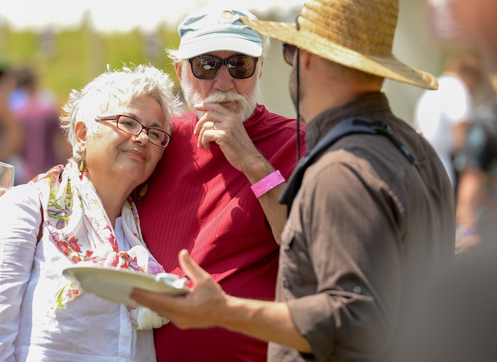Leah Hogsten | The Salt Lake Tribune l-r Despina and Dewey Yeargin of Greenwood, SC have been attending the annual Taste of the Wasatch food and wine event for 12 years, seen Sunday, August 5, 2018 talking with their friend Chris Snarr at Solitude. The Yeargins plan their yearly Utah vacation around the Taste of the Wasatch and the Kimball Arts Show every year. This year they brought six friends with them.