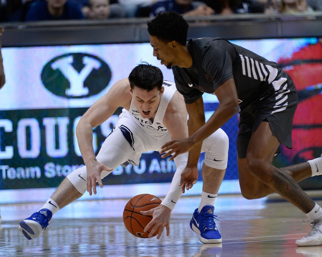 (Francisco Kjolseth  |  The Salt Lake Tribune) Brigham Young Cougars guard Alex Barcello (4) regains control of the ball over Santa Clara Broncos guard Tahj Eaddy (2) in the first half as the Brigham Young Cougars host the Santa Clara Broncos at the Marriott Center in Provo, Thursday, Feb. 20, 2020.