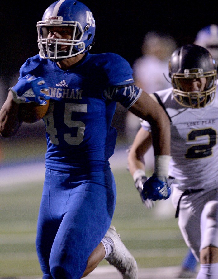 (Leah Hogsten | The Salt Lake Tribune) Bingham's Junior Tafuna with the intercepted touchdown run in the second half. Bingham High School defeated Lone Peak High School, 28-10 during their game Friday, September 28, 2017 in South Jordan.