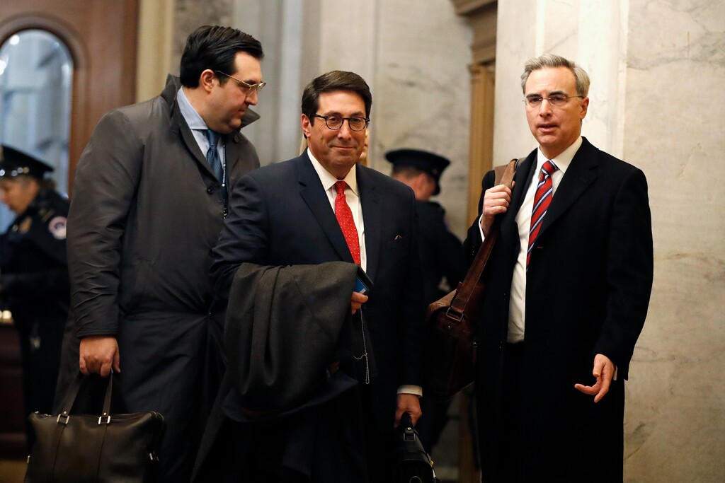 (Julio Cortez | AP)President Donald Trump's personal attorney Jay Sekulow, center, stands with his son, Jordan Sekulow, left, and White House Counsel Pat Cipollone, while arriving at the Capitol in Washington during the impeachment trial of President Donald Trump on charges of abuse of power and obstruction of Congress, Saturday, Jan. 25, 2020.