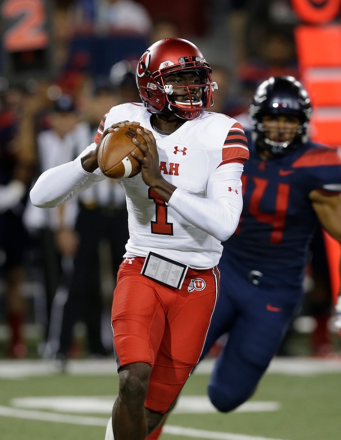 Utah quarterback Tyler Huntley (1) in the first half during an NCAA college football game against Arizona, Friday, Sept. 22, 2017, in Tucson, Ariz. (AP Photo/Rick Scuteri)