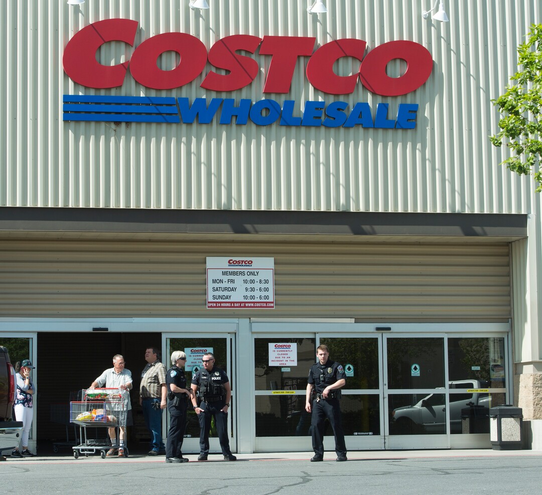 (Rick Egan  |  The Salt Lake Tribune)    Bountiful police close the Costco store as they investigate a shooting and attempted armed robbery at Bountiful Pawn and Sales on Thursday, May 3, 2018.