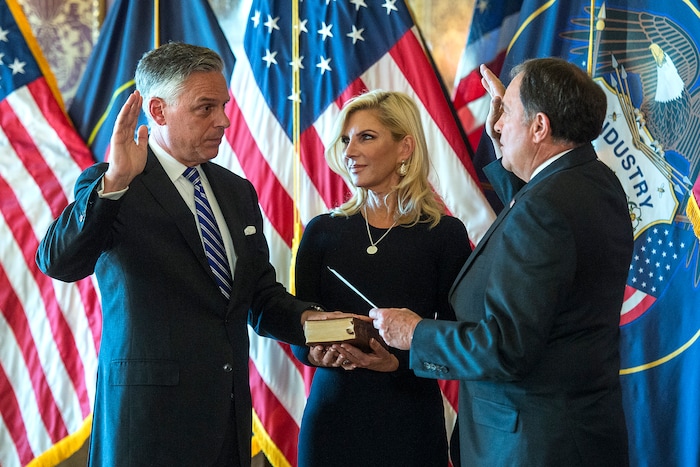 (Chris Detrick  |  The Salt Lake Tribune)  Gov. Gary R. Herbert swears in Jon M. Huntsman, Jr. as U.S. Ambassador to Russia during an Ambassadorial Swearing in Ceremony at the Utah Capitol Saturday, October 7, 2017. Mary Kaye Huntsman is in the middle.